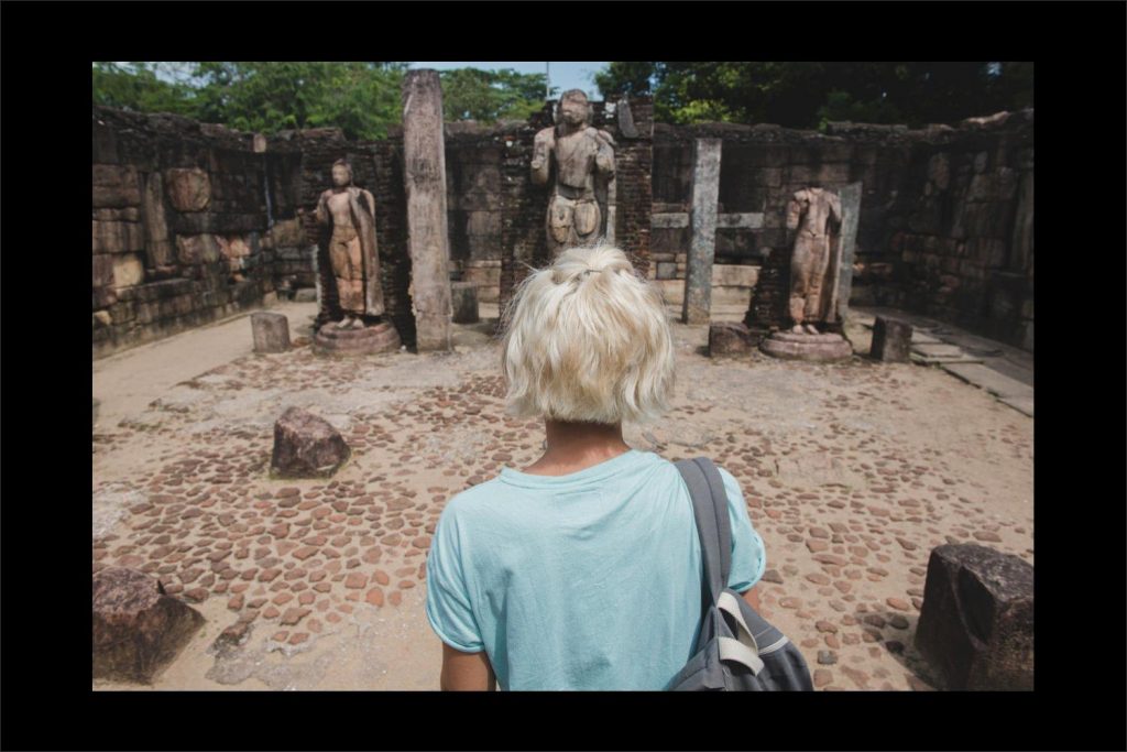 Sri Lanka photographer: walking to the stone statues at the ruins.