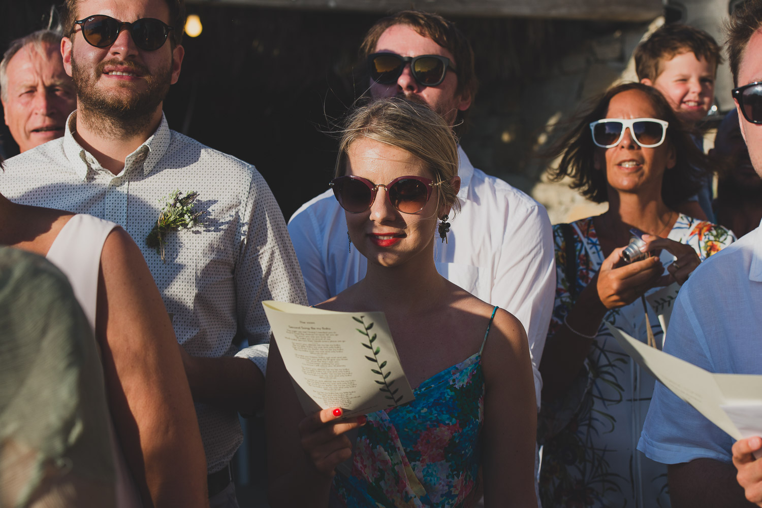 Wedding photographer Mykonos: guests singing at Mykonos wedding.
