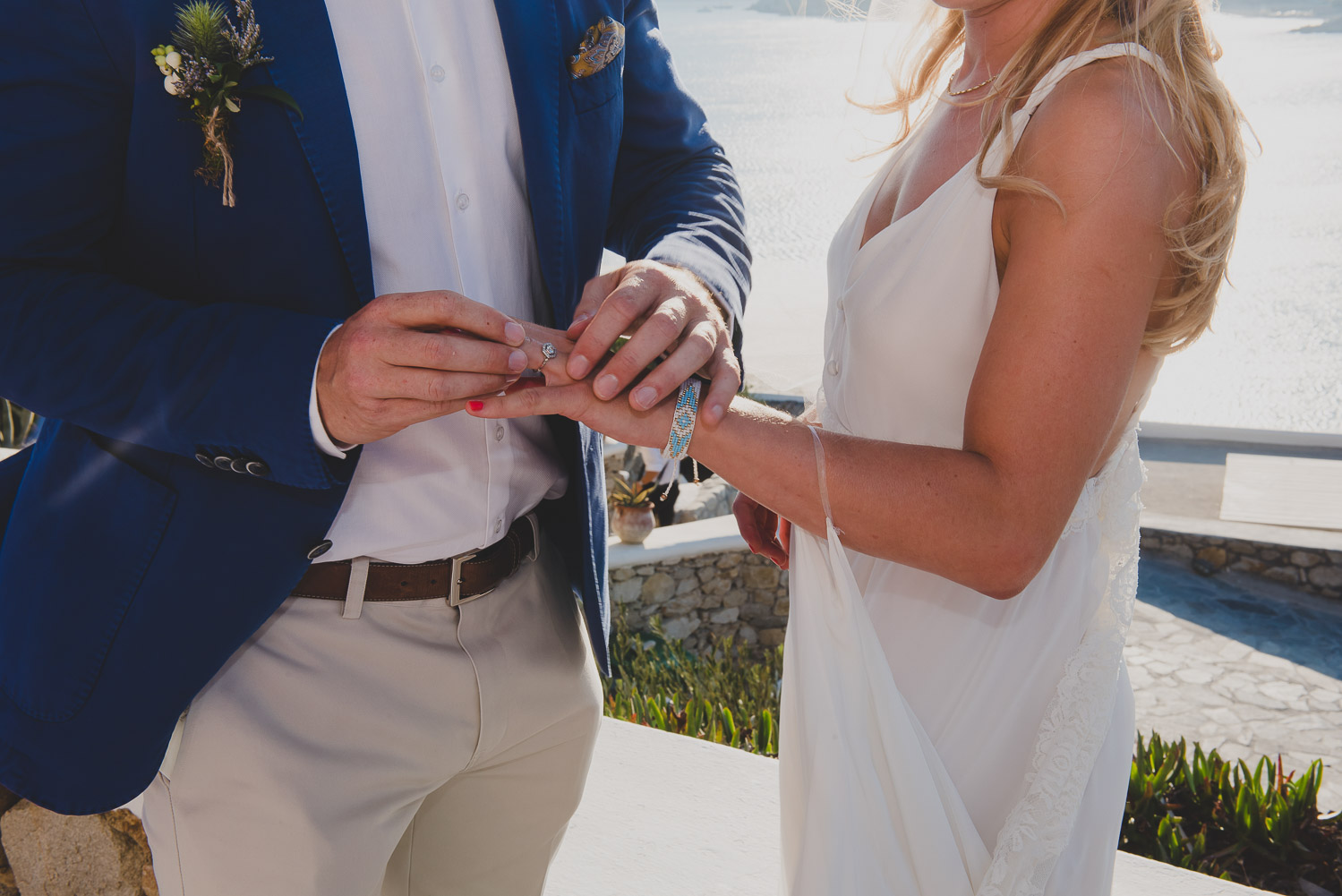 Wedding photographer Mykonos: close up of ring exchange during Mykonos wedding.