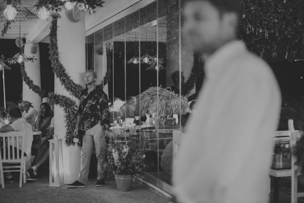 Wedding photographer Mykonos: a break in black and white at Elia beach Mykonos wedding reception.