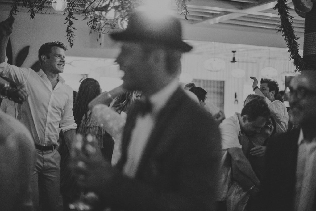 Wedding photographer Mykonos: dancing in black and white at Elia beach Mykonos wedding.
