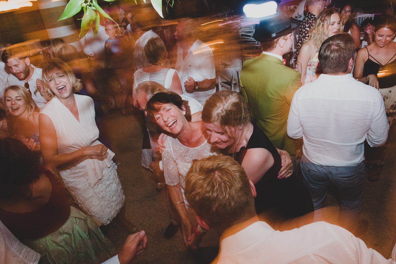 Wedding photographer Mykonos: dancing and singing at Elia during Mykonos wedding.