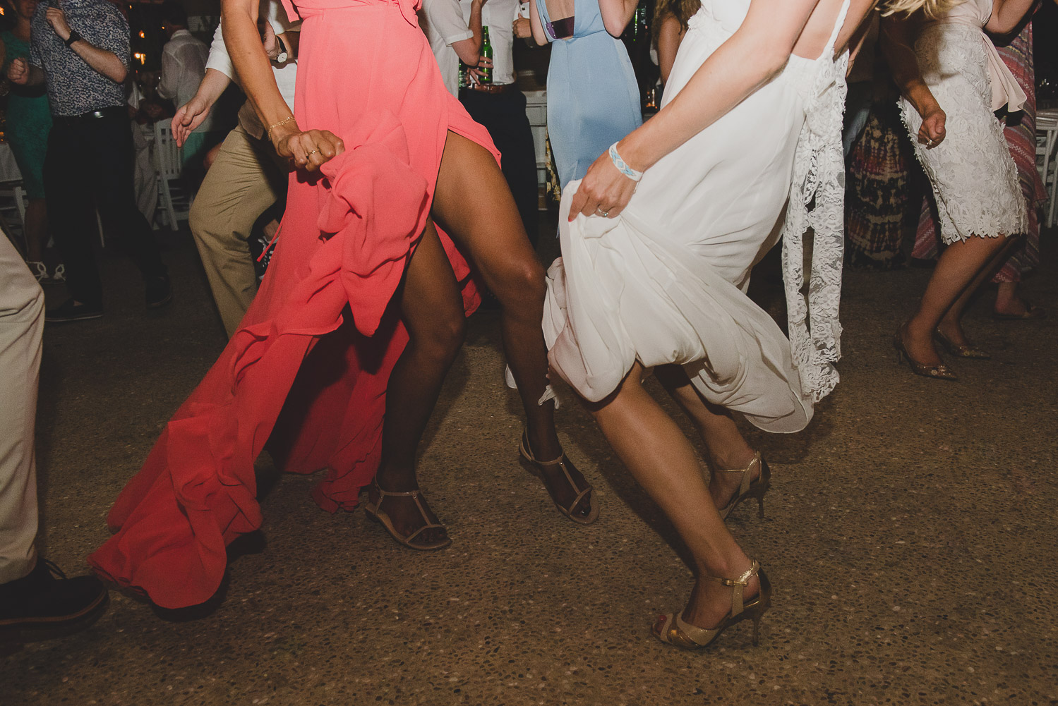 Wedding photographer Mykonos: dresses on the dance floor at Elia during Mykonos wedding.