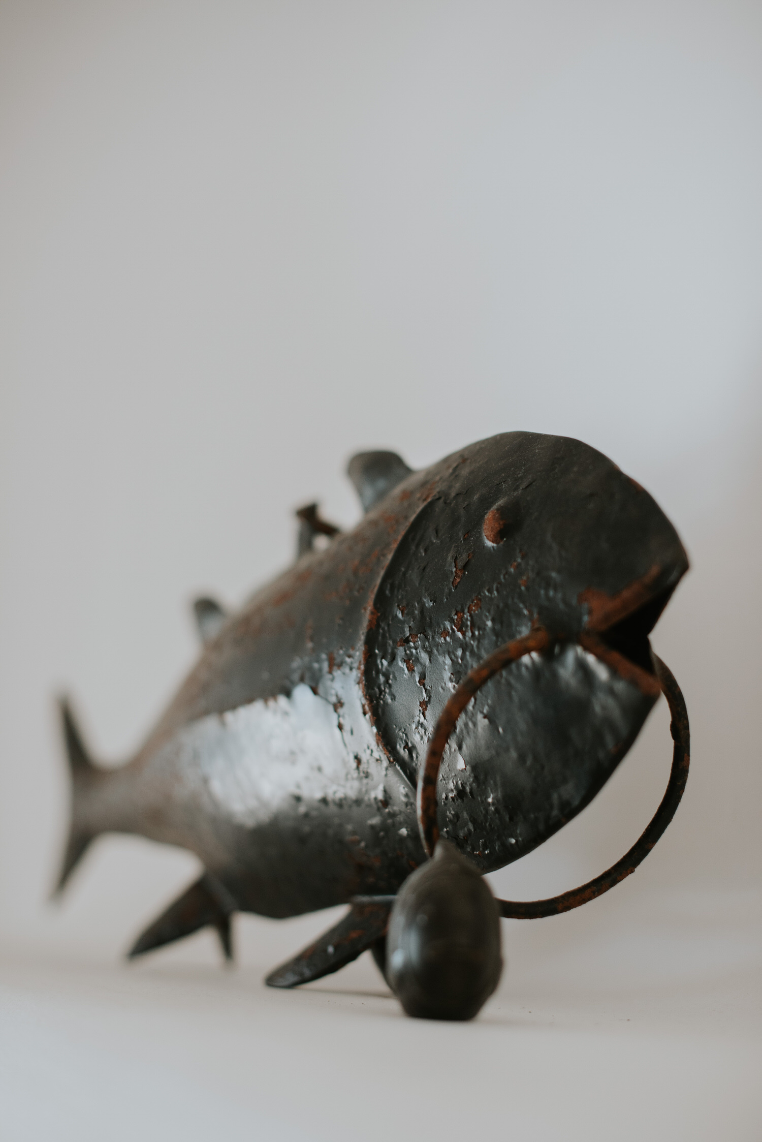 Mykonos wedding photographer: metal fish sculpture detail in the villa.