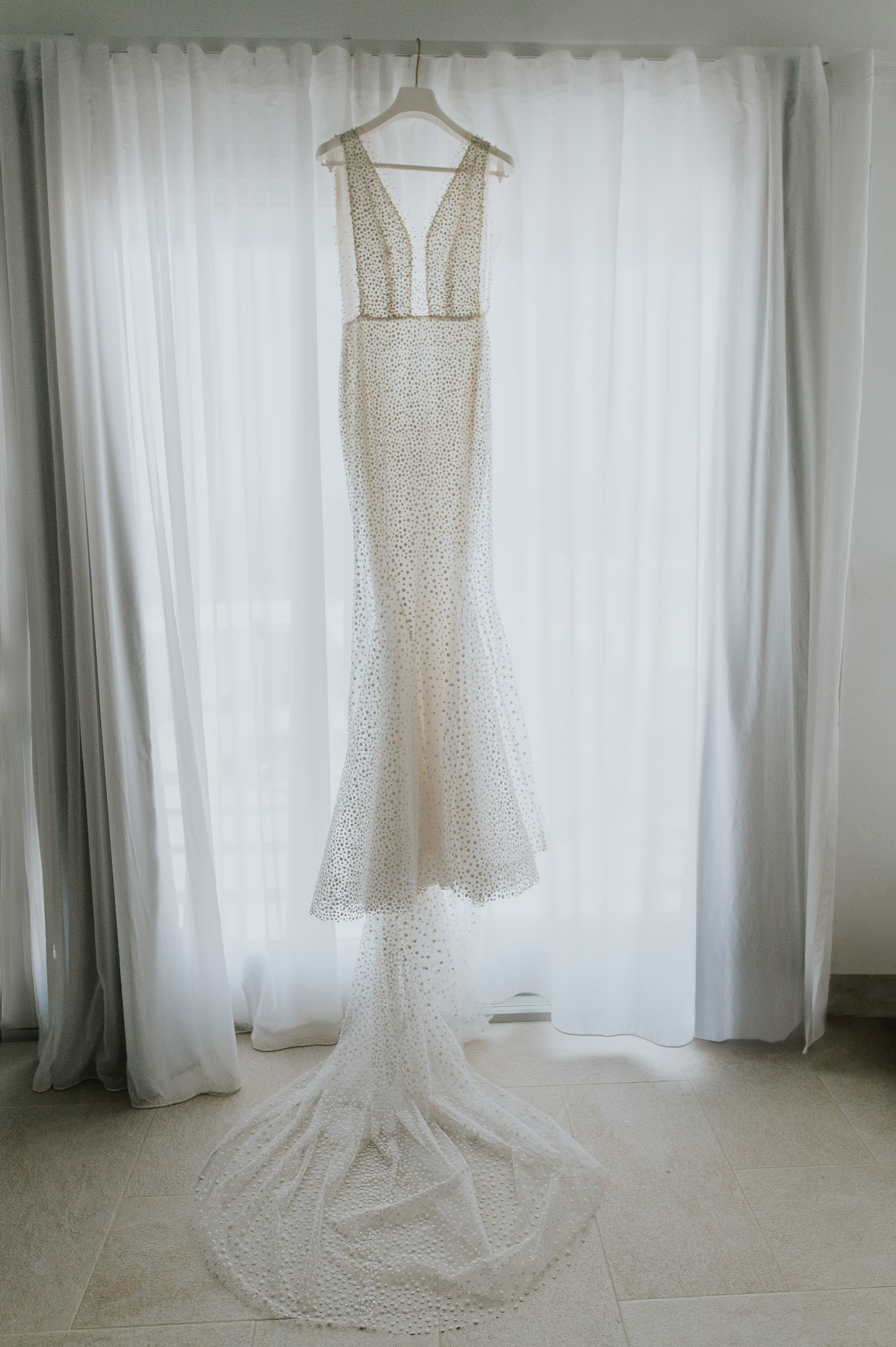 Rocabella Santorini Wedding: bride's details with her sparkling wedding dress by Wedding photographer Santorini.